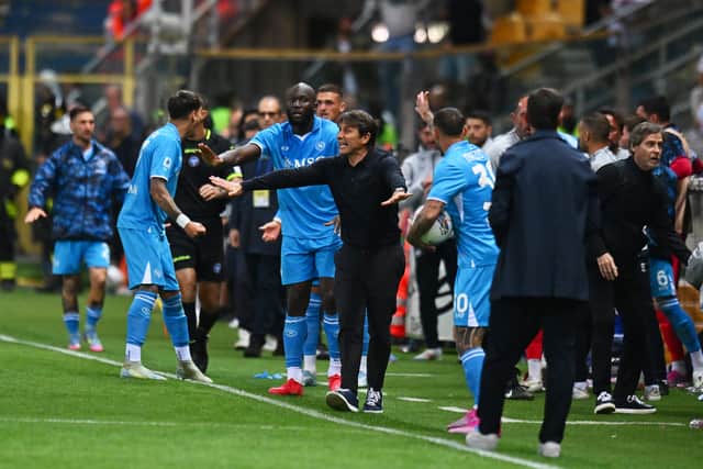 Napoli manager Antonio Conte calls for calm during the match against Parma.