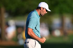 World No 1 Scottie Scheffler reacts on the 18th green after a closing birdie in the third round of the PGA Championship at Quail Hollow Country Club in Charlotte, North Carolina