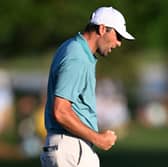 World No 1 Scottie Scheffler reacts on the 18th green after a closing birdie in the third round of the PGA Championship at Quail Hollow Country Club in Charlotte, North Carolina