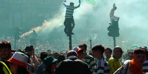 Celtic fans celebrate outside Celtic Park following the William Hill Premiership match at Celtic Park, Glasgow. Picture date: Saturday May 17, 2025. PA Photo. See PA story SOCCER Celtic. Photo credit should read: Jane Barlow/PA Wire.RESTRICTIONS: Use subject to restrictions. Editorial use only, no commercial use without prior consent from rights holder.