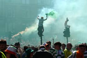 Celtic fans celebrate outside Celtic Park following the William Hill Premiership match at Celtic Park, Glasgow. Picture date: Saturday May 17, 2025. PA Photo. See PA story SOCCER Celtic. Photo credit should read: Jane Barlow/PA Wire.RESTRICTIONS: Use subject to restrictions. Editorial use only, no commercial use without prior consent from rights holder.