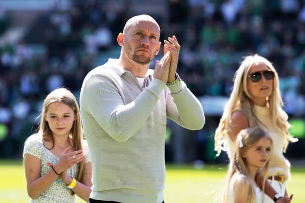 David Gray  - joined by wife Hayley and daughters Ada and Ivy - takes the applause of Hibs fans after the 2-2 draw against Rangers.