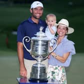 Scottie Scheffler poses with the Wanamaker Trophy with his wife Meredith and son Bennett after winning the 107th PGA Championship at Quail Hollow  in Charlotte, North Carolina