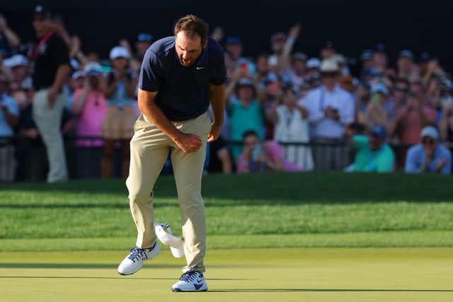 Scottie Scheffler celebrates on the 18th green after claiming his third major title in just 23 starts