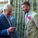 King Charles III chats to footballer David Beckham at the Chelsea Flower Show.