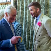 King Charles III chats to footballer David Beckham at the Chelsea Flower Show.