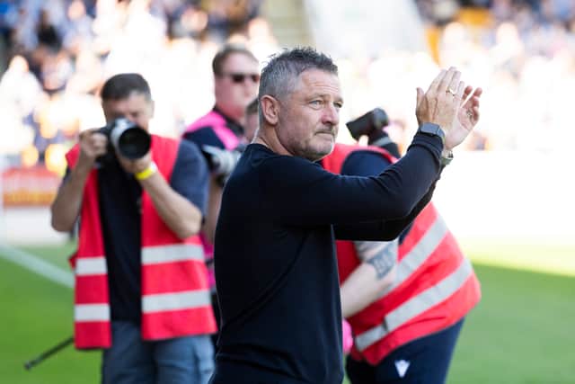 Dundee manager Tony Docherty applauds the 4000 travelling fans after the 2-0 win at St Johnstone which secured Premiership safety in what turned out to be his last match in charge. (Photo by Paul Devlin / SNS Group)