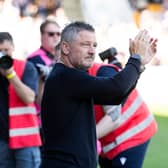 Dundee manager Tony Docherty applauds the 4000 travelling fans after the 2-0 win at St Johnstone which secured Premiership safety in what turned out to be his last match in charge. (Photo by Paul Devlin / SNS Group)