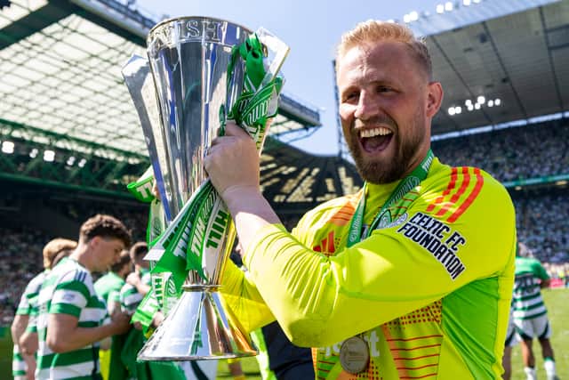 Celtic's Kasper Schmeichel with the league trophy after the 1-1 draw with St Mirren. (Photo by Ross MacDonald / SNS Group)