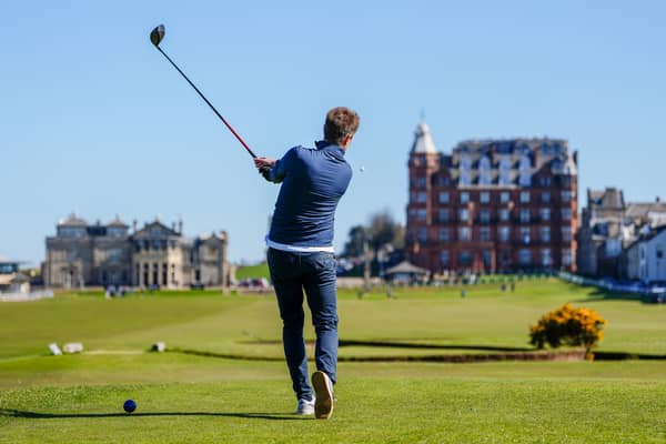 A player tees off the on the 18th hole on the Old Course, where 44 Scottish golfers will play on Wednesday for just £42.50 each