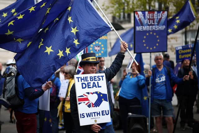 Anti-Brexit demonstrator Steve Bray and fellow pro EU-activists wave flags as they protest near Lancaster House, the venue of the UK-EU Summit in London