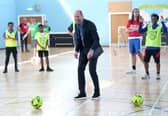 The Prince of Wales, known as the Duke of Rothesay when in Scotland, plays football during a visit to Leith Community Centre in Edinburgh. Picture: Chris Jackson/PA Wire