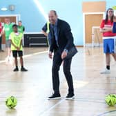 The Prince of Wales, known as the Duke of Rothesay when in Scotland, plays football during a visit to Leith Community Centre in Edinburgh. Picture: Chris Jackson/PA Wire