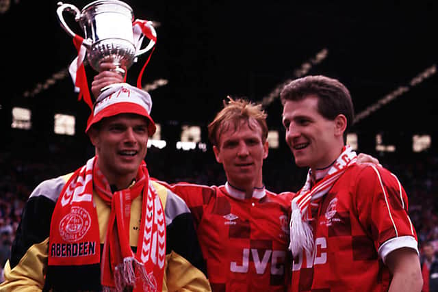 Aberdeen trio Theo Snelders (left), Alex McLeish (centre) and Brian Irvine celebrate with the Scottish Cup after the penalty shoot-out win over Celtic in the 1990 final.