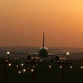 Aircraft taking off into the sunset at Edinburgh Airport