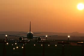 Aircraft taking off into the sunset at Edinburgh Airport