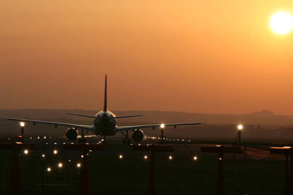 Aircraft taking off into the sunset at Edinburgh Airport