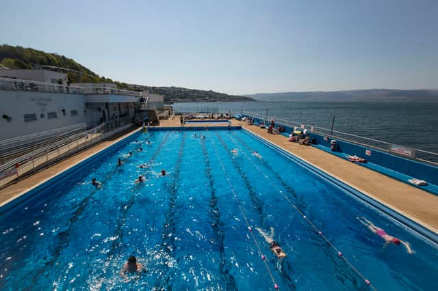 Swimmers and sunbathers enjoy the hot weather at Gourock Outdoor Pool