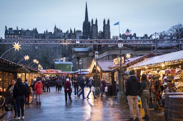 Shoppers at the Christmas Market on Edinburgh's Princes Street.
