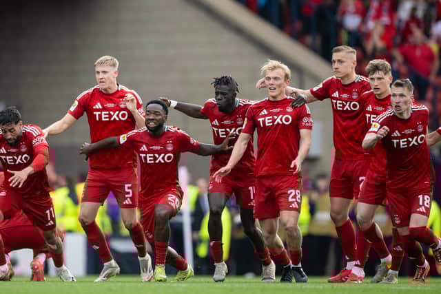 Aberdeen's player rush away to celebrate the victory.