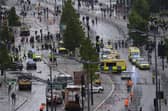Police and emergency personnel dealing with a road traffic incident on Water Street near the Liver Building in Liverpool after a car collided with pedestrians during the Premier League winners' parade