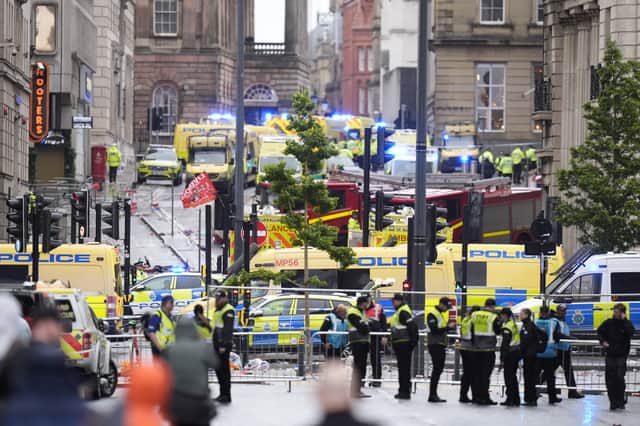 Police and emergency personnel dealing with the road traffic incident on Water Street near the Liver Building in Liverpool