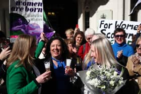 For Women Scotland members (Maya Forstater centre) celebrate outside the UK Supreme Court.