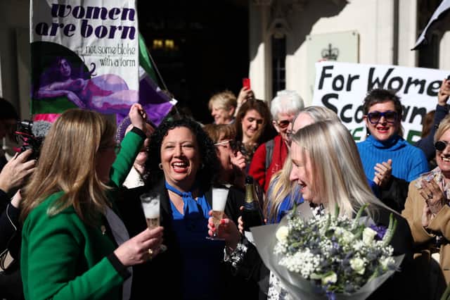 For Women Scotland members (Maya Forstater centre) celebrate outside the UK Supreme Court.
