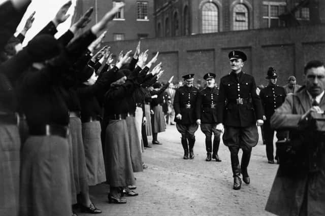 Oswald Mosley, leader of the British Union of Fascists, inspects a parade of supporters before calling off a march through London's East End in 1936 (Picture: Becker/Fox Photos)