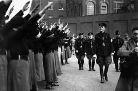 Oswald Mosley, leader of the British Union of Fascists, inspects a parade of supporters before calling off a march through London's East End in 1936 (Picture: Becker/Fox Photos)