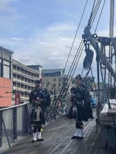 Archie Borthwick and Ollie Little, from the Loretto School Pipe Band piping onboard D/S Hestmanden on Monday.