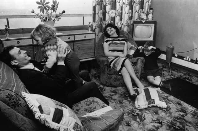To See Ourselves, by Alistair Moffat, charts decades of rapid social change in Scotland over his lifetime. Pictured is a family in their new flat in Glasgow in the 1960s, a time when new affordable household goods redefined home life and how we spent our time. PIC: Albert McCabe/Hulton Archive/Getty Images