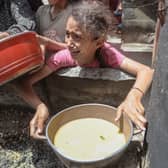 A girl appears to be in distress after receiving food at Jabalia refugee camp, Gaza City, earlier this month (Picture: Abood Abusalama)