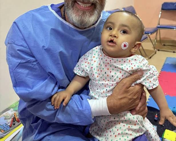 Dragons Den star Duncan Bannatyne with eight-month-old Zyad, who was heading into surgery for a cleft palette operation
