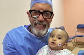Dragons Den star Duncan Bannatyne with eight-month-old Zyad, who was heading into surgery for a cleft palette operation
