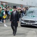 Hibs fans applauded as the hearse made its was through the stadium.