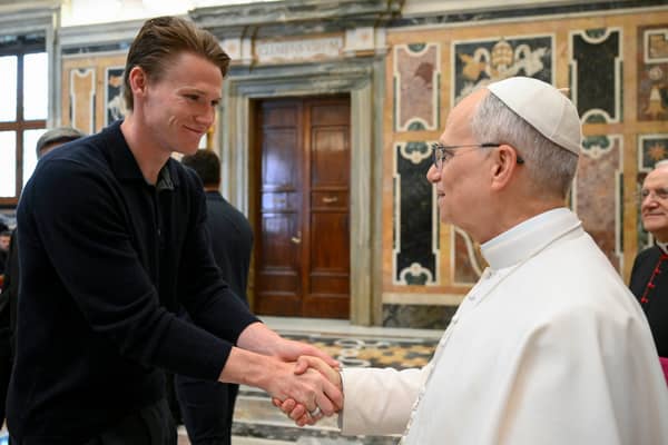 Napoli and Scotland midfielder Scott McTominay (left) shakes hands with Pope Leo XIV during a papal private audience with the team in the Clementine Hall at the Vatican. Picture: Vadican Media via AP