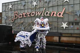 A lion from the Glasgow Hong Lok Dragon Dance Troop (Est 2001) does a dance ahead of the Hong Kong Street Market at the  Barras Market this Saturday and Sunday.