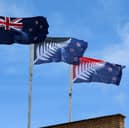 A New Zealand flag, left, flies alongside two suggested replacements (Picture: Fiona Goodall)