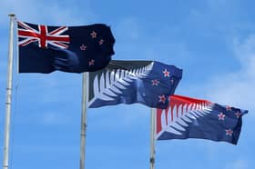 A New Zealand flag, left, flies alongside two suggested replacements (Picture: Fiona Goodall)