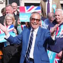Reform UK leader Nigel Farage poses outside a pub in Morpeth, Northumberland, on the local election campaign trail in April