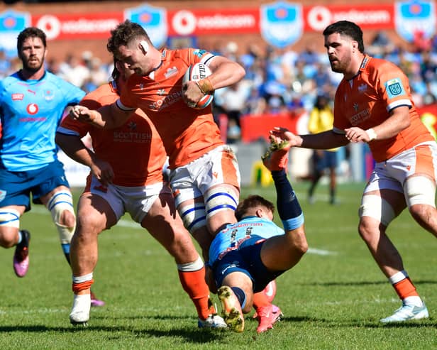 Magnus Bradbury of Edinburgh is tackled by the Bulls' Sebastian de Klerk during the URC quarter-final at Loftus Versfeld.