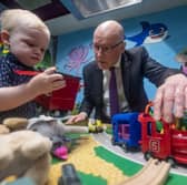 First Minister John Swinney with Rory Lees, aged 2, during a visit to Juniors Charity in Hamilton, Lanarkshire, while on the campaign trail ahead of the upcoming Hamilton, Larkhall and Stonehouse by-election on Thursday