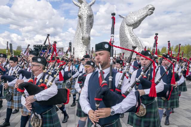 Massed pipe bands play during celebrations of the tenth anniversary of the Kelpies in Falkirk (Picture: Jane Barlow)