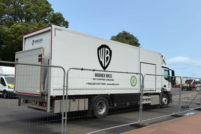 Trucks bearing the Warner Bros logo have appeared in an Edinburgh park.