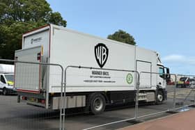 Trucks bearing the Warner Bros logo have appeared in an Edinburgh park.