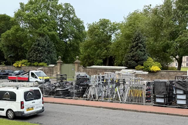 The car park is being used to store film equipment.