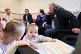 Children Erin McLay and Kai Johnstone play as Scottish Labour leader Anas Sarwar, deputy Jackie Ballie and candidate Davy Russell meet with local parents including Amanda Todd (left) raising concerns about the potential downgrade of services at Wishaw General Hospital (Photo by Jeff J Mitchell/Getty Images)