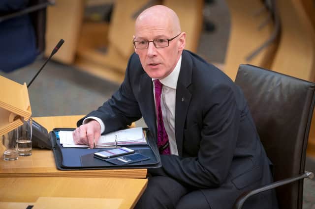 Getting John Swinney to answer a question can prove frustrating, but he will need to find one for the looming black hole in the Scottish Government's finances (Picture: Jane Barlow/pool)