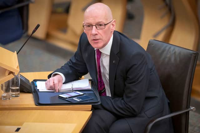 Getting John Swinney to answer a question can prove frustrating, but he will need to find one for the looming black hole in the Scottish Government's finances (Picture: Jane Barlow/pool)